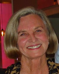 Suzanne Roberts , a founder of the United States Academic Decathlon (USAD), smiling at an event.